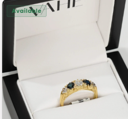 White diamond and sapphire trilogy ring